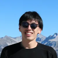 A man outdoors wearing glasses.